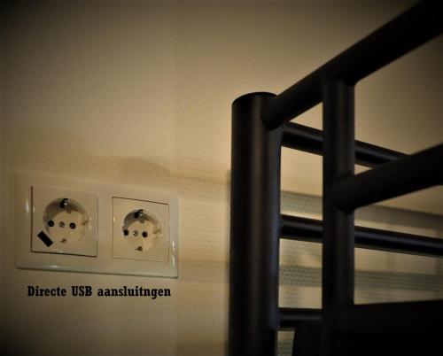 a close up of a room with a bed and switches at Hotel 't Anker in Leeuwarden