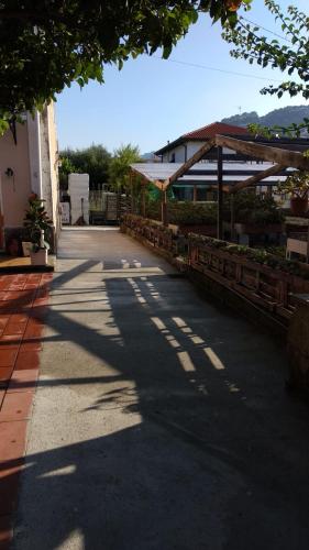a shadow of a building on a street at Ca' Federica in Vallecrosia