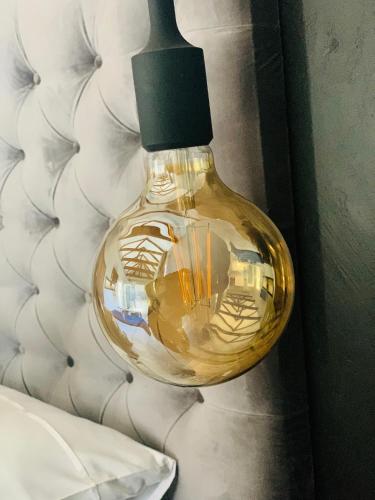 a close up of a glass lamp on a wall at Monte Vista in Harrismith