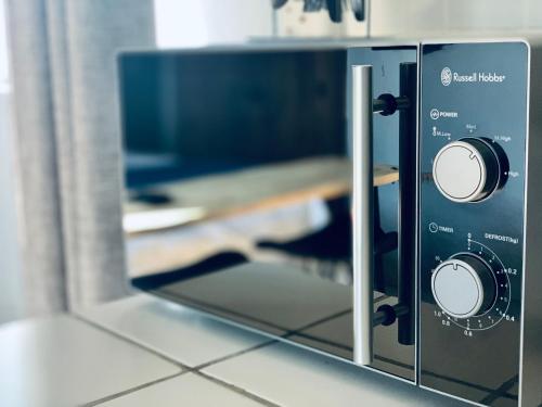 a microwave oven sitting on top of a counter at Monte Vista in Harrismith
