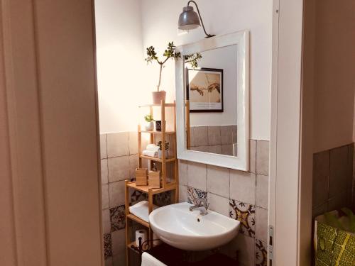 a bathroom with a sink and a mirror at CALIMARA18 25" from Florence AC SmartTV in Prato