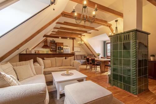 a living room with a couch and a table at Historický dům u lázní in Třeboň
