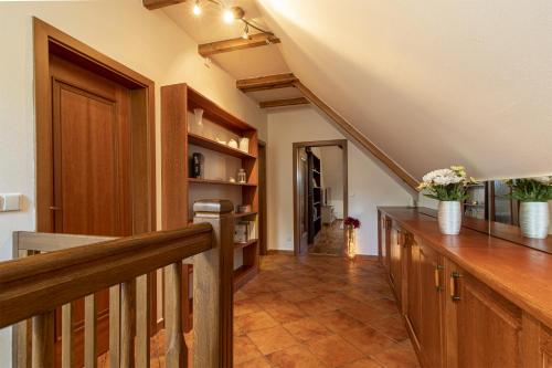a hallway with a staircase and a stair case at Historický dům u lázní in Třeboň