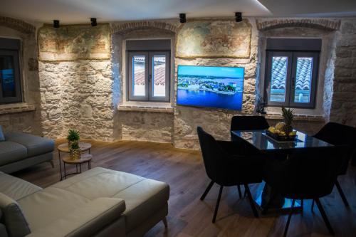 a living room with a couch and a table at Oli mare in Poreč
