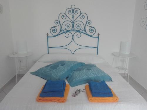 Postel nebo postele na pokoji v ubytování Le pavoncelle blu