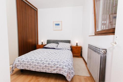 Postel nebo postele na pokoji v ubytování Ovcina Garden view residence