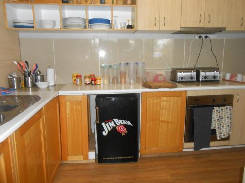 a kitchen with a black bag on the oven at Mount View Motel in Bulahdelah