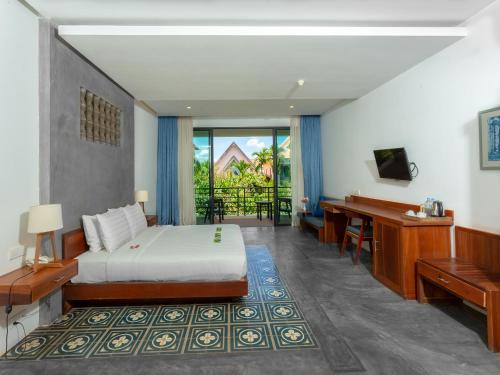 Postel nebo postele na pokoji v ubytování Tanei Angkor Resort and Spa