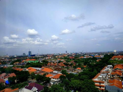 a view of a city with houses and buildings at PrimeBiz Hotel Surabaya in Surabaya