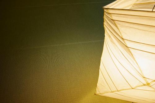 a close up of a white umbrella in a room at TSUKI Tokyo in Tokyo