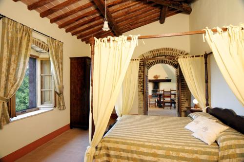 Кровать или кровати в номере Castellare