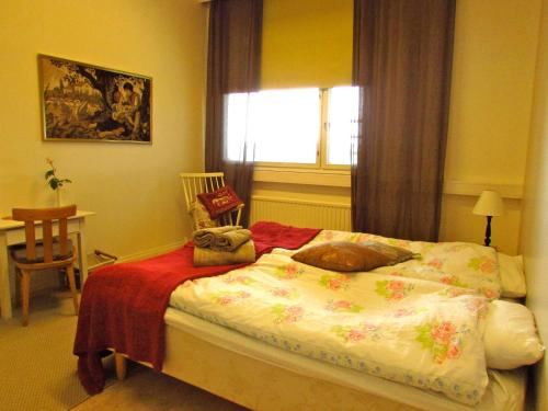 Ένα ή περισσότερα κρεβάτια σε δωμάτιο στο Majatalo Myötätuuli