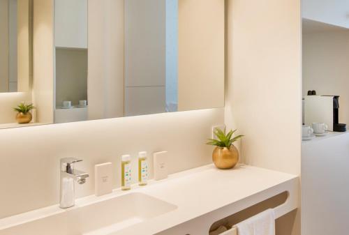 a bathroom with a sink and a mirror at Golden Costa Salou - Adults Only 4* Sup in Salou