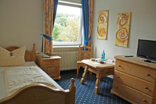TV a/nebo společenská místnost v ubytování Wildpark Hotel