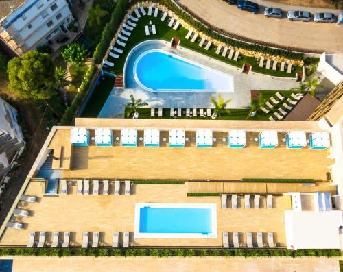 an overhead view of a resort with a swimming pool at Golden Costa Salou - Adults Only 4* Sup in Salou