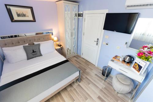 Una cama o camas en una habitación de Primero Hotel