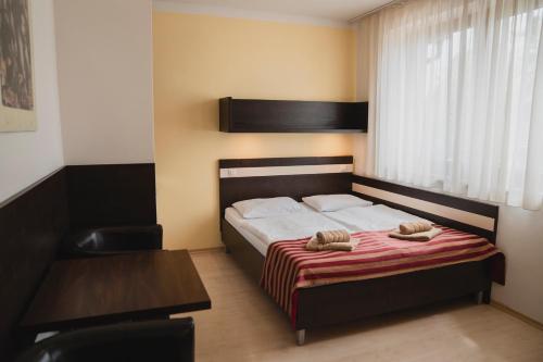 Postel nebo postele na pokoji v ubytování Apartmán Angelika