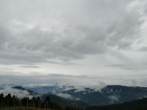 a view of the mountains and clouds in the sky at Vikendica RANKOVIĆI in Mokra Gora