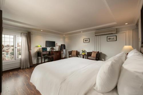 Cama o camas de una habitación en Hong Ngoc Dynastie Boutique Hotel & Spa
