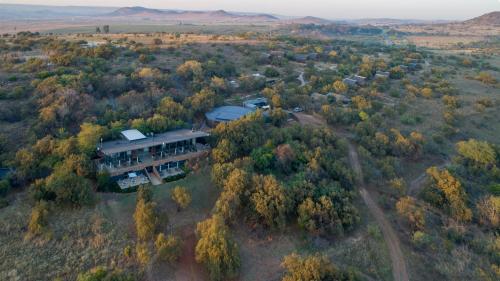 an aerial view of a large house in the woods at Cradle Boutique Hotel in Lanseria