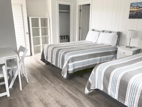 Ένα ή περισσότερα κρεβάτια σε δωμάτιο στο Kingfisher Oceanside