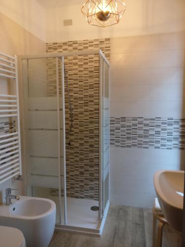 a bathroom with a shower and a sink at Foresteria Sirio in Gorgonzola