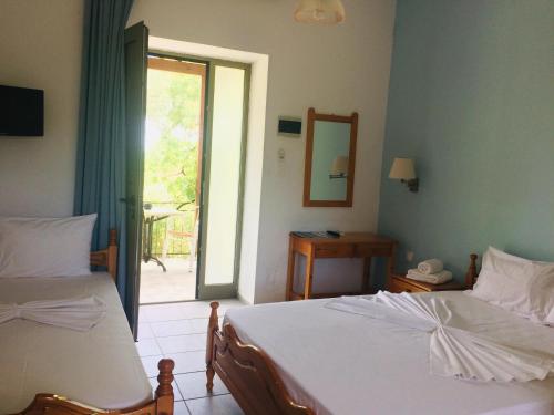 Cama o camas de una habitación en Paradisos Studios