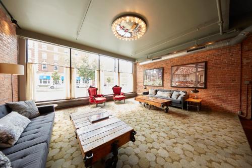 a living room with a couch and a table at Hotel on North in Pittsfield