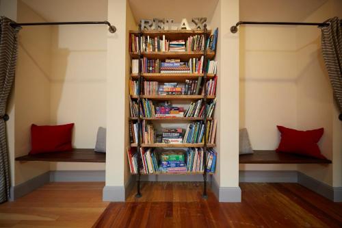 a book shelf filled with books in a room at Hotel on North in Pittsfield