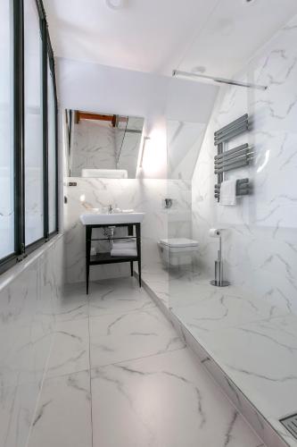Ένα ή περισσότερα κρεβάτια σε δωμάτιο στο Apartamenty Chleb i Wino