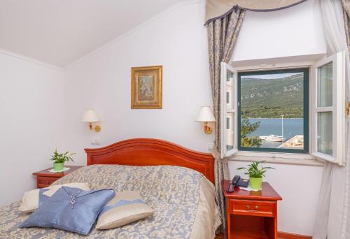 Postel nebo postele na pokoji v ubytování Hotel Ostrea