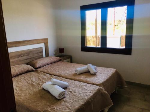 A bed or beds in a room at CASA RIBAS