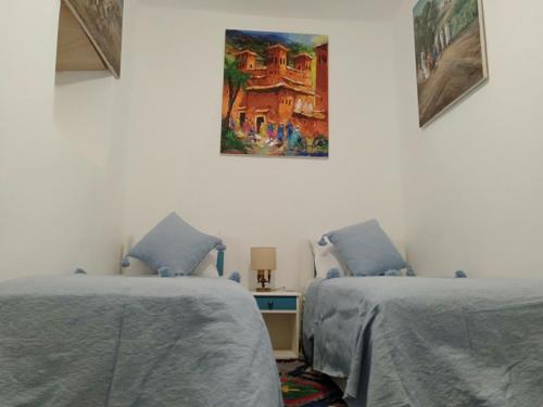 Кровать или кровати в номере Appartements la grotte