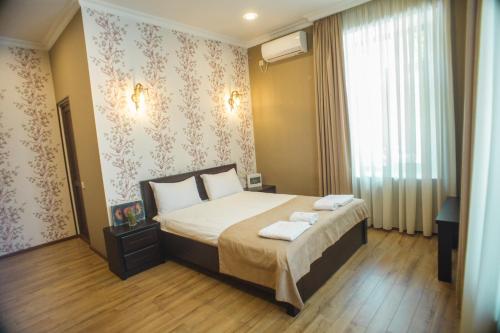 Кровать или кровати в номере Hotel Almi