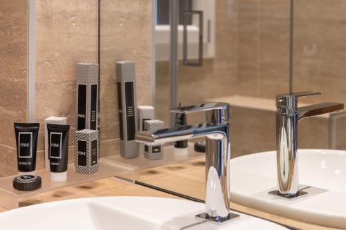 a bathroom with a sink and a mirror at Sea Tower Torre Telemetrica Lido di Venezia in Venice-Lido