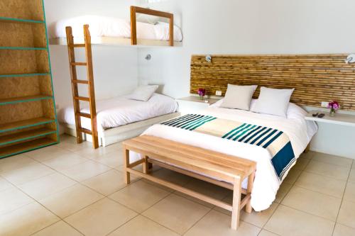 Ένα ή περισσότερα κρεβάτια σε δωμάτιο στο Entre Palmeras