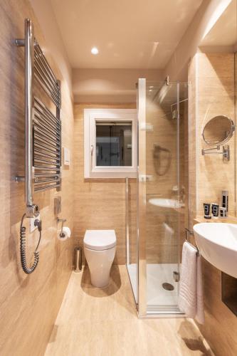 a bathroom with a shower and a toilet and a sink at Sea Tower Torre Telemetrica Lido di Venezia in Venice-Lido