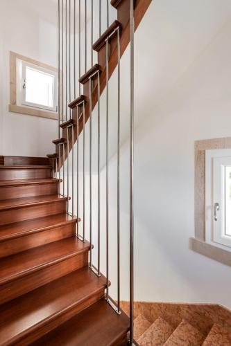 a staircase in a home with wood treads at Sea Tower Torre Telemetrica Lido di Venezia in Venice-Lido