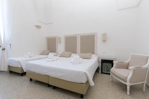 Ένα ή περισσότερα κρεβάτια σε δωμάτιο στο Masseria Mazzetta Salento Corte del Falconiere B&B