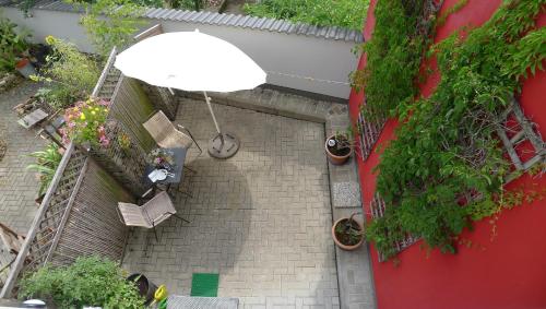 an overhead view of a stairs with a white umbrella at Ferienhaus 13b in Bad Orb