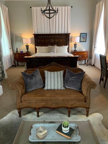a living room with a couch and a bed at The Kendall in Boerne