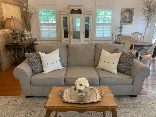 a living room with a couch and a table at The Kendall in Boerne