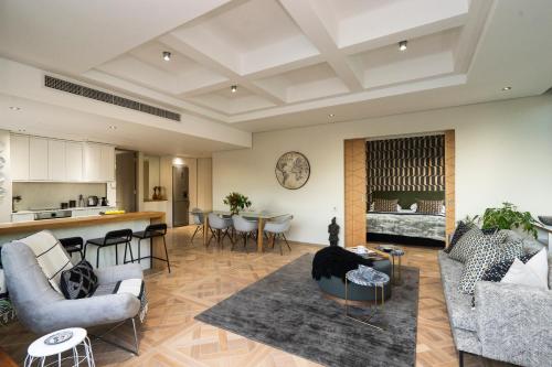 a living room with a couch and a table at #1803 Cartwright - Simply Spectacular in Cape Town