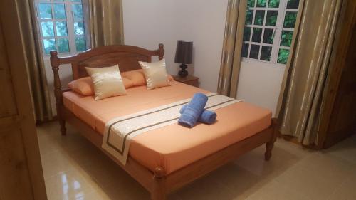 Ένα ή περισσότερα κρεβάτια σε δωμάτιο στο Anse Royale Bay View Apartments