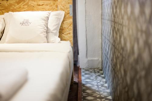 Ένα ή περισσότερα κρεβάτια σε δωμάτιο στο Goodmorning Solo Traveller Hostel
