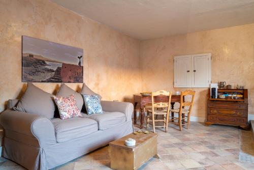 a living room with a couch and a table at El Hotelito del Cotillo - Adults Only in Cotillo