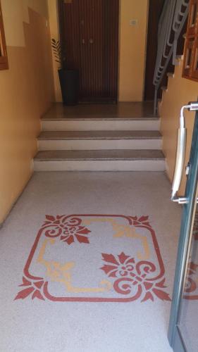 a stairway with a rug on the floor next to stairs at Casa Midori in Lecce