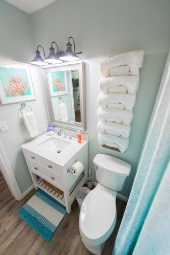 a bathroom with a white toilet and a sink at Grand Beach Resort Unit 313 in Gulf Shores
