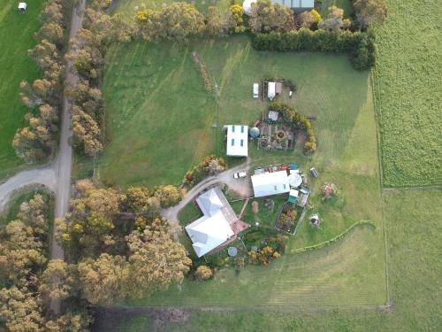 an aerial view of a estate with a white house at Aashay Country Stay in Fish Creek