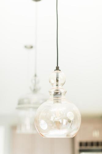 a glass light fixture hanging from a ceiling at The Lakes at Ben Eoin Golf Club & Resort in Big Pond